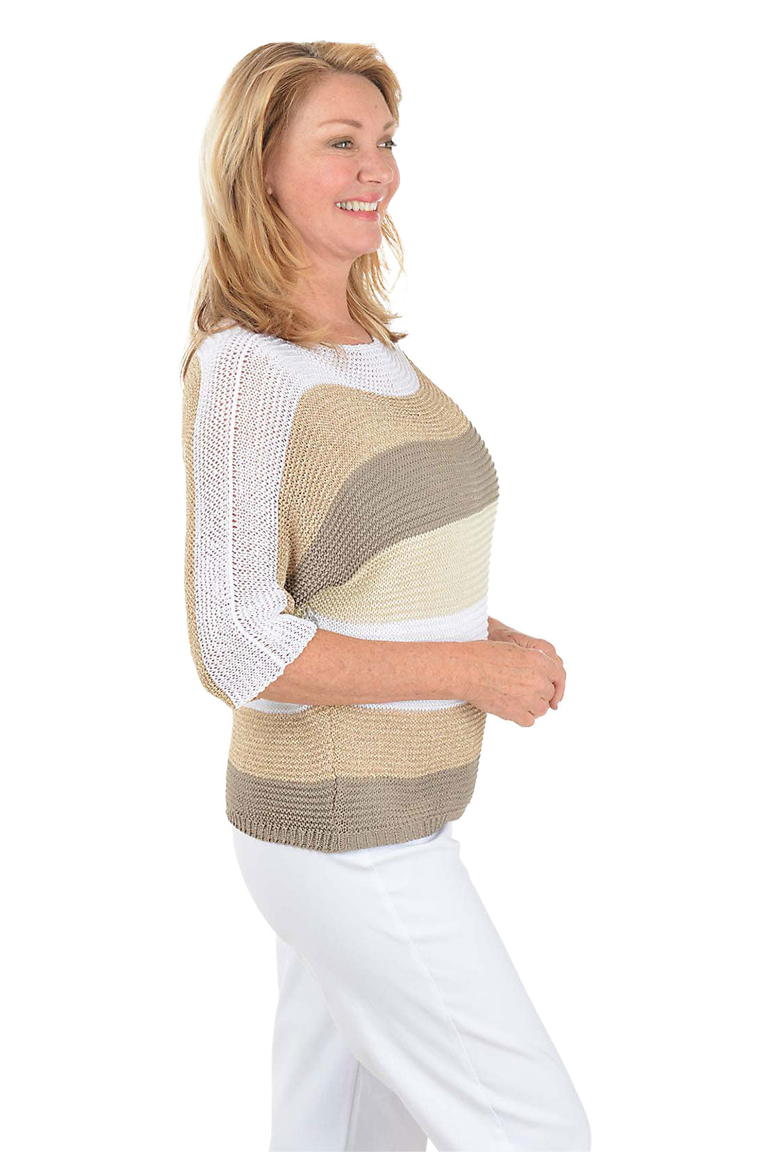 Woman wearing a striped sweater with a white background. Side shot.
