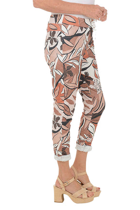 Patterned pants worn by a person on a white background. Side shot.