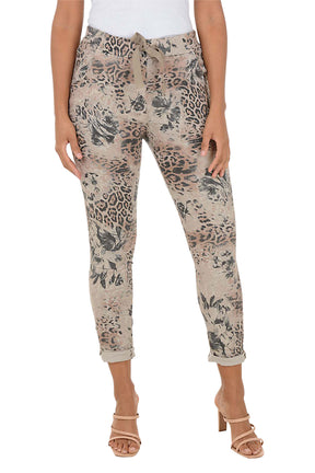 Patterned pants worn by a person on a white background.