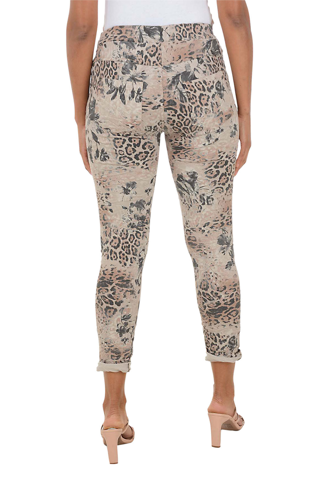 Patterned pants worn by a person on a white background. Back shot.