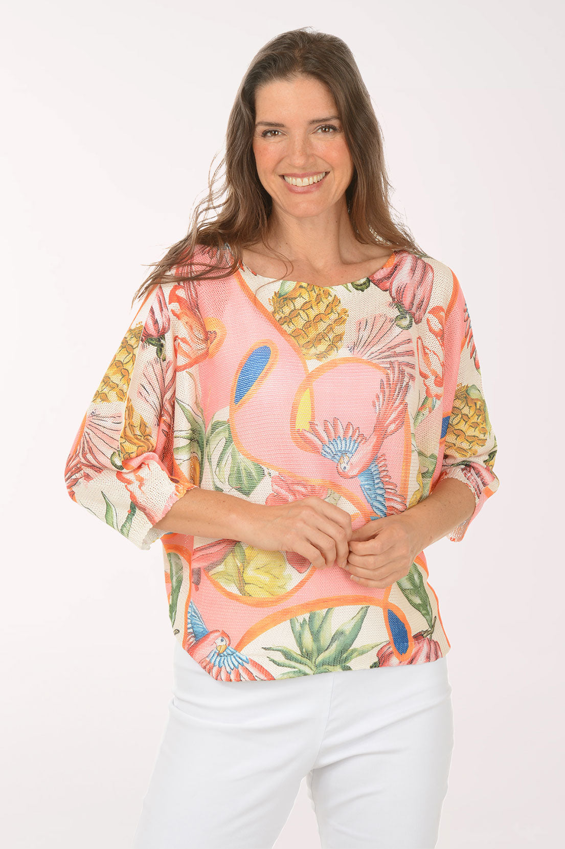 Woman wearing a multicolored slouchy pink sweater.