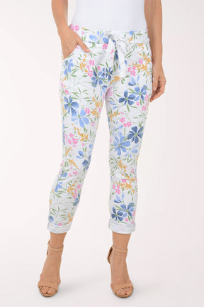 Woman wearing multicolored floral joggers.