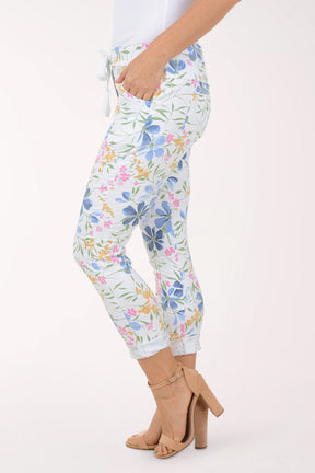 Woman wearing multicolored floral joggers.