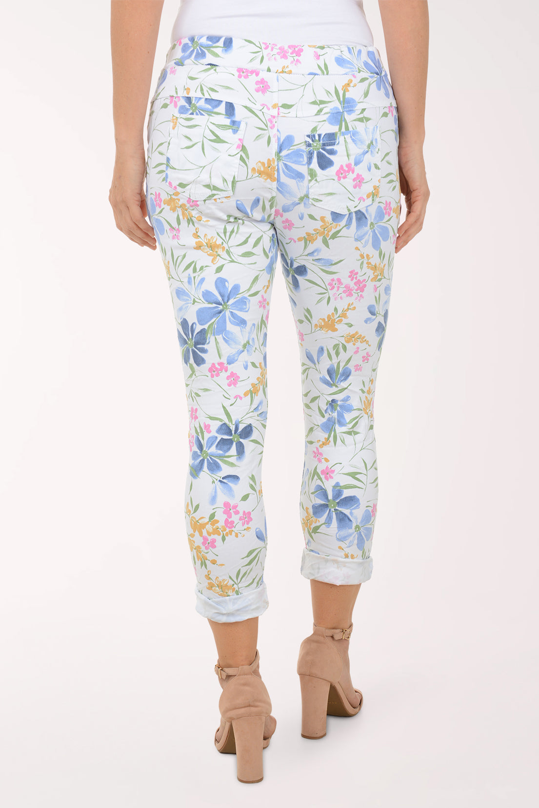 Woman wearing multicolored floral joggers.
