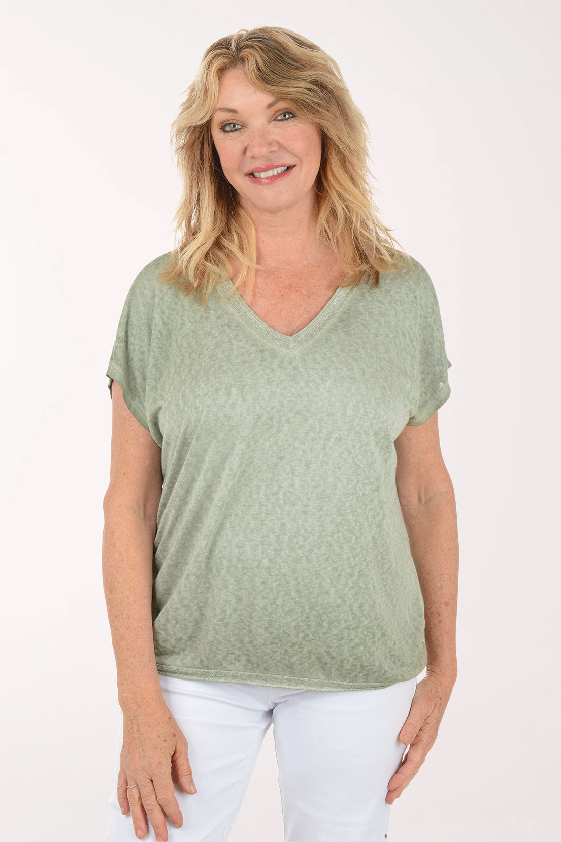 Woman wearing a short sleeve v-neck green tee.