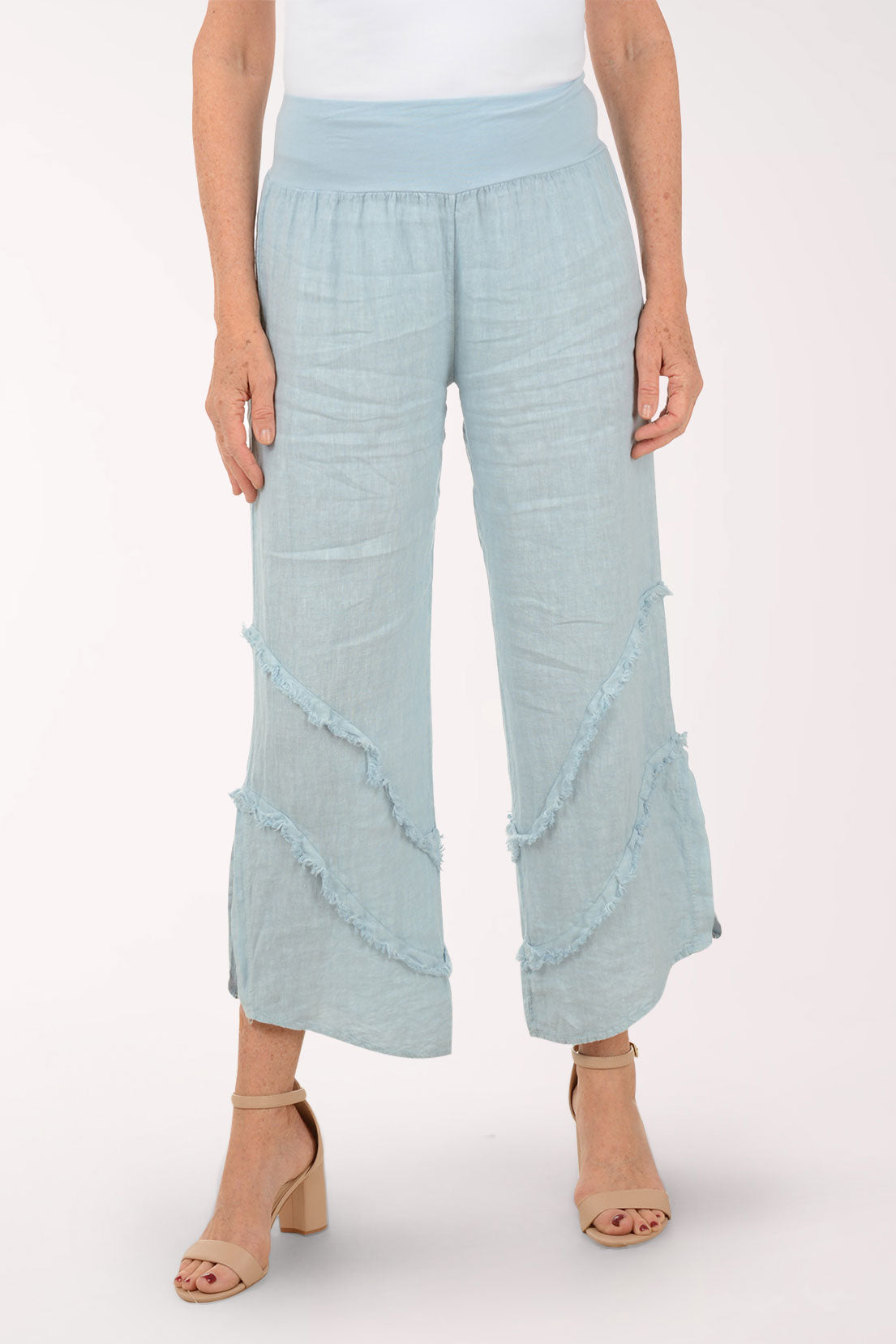 Woman wearing blue flowy pants.