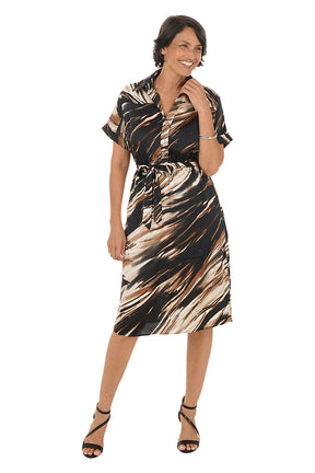 Woman wearing a brown patterned dress on a white background. Second front shot.