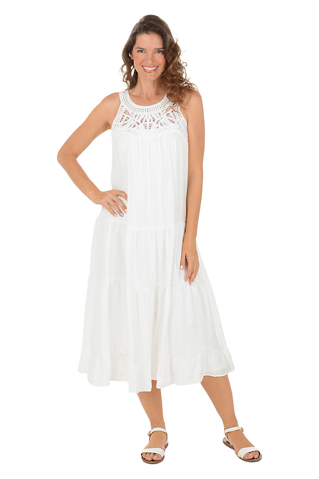 A woman wearing a white halter midi dress with a crochet neckline. 
