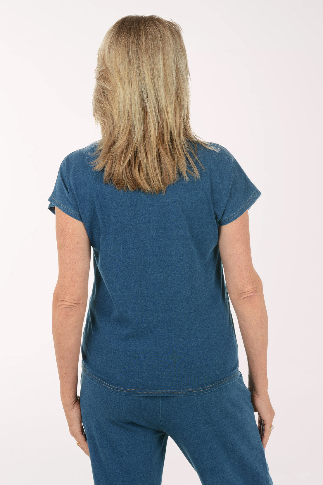 Woman wearing a blue outfit on a white background