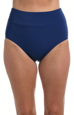 Person wearing navy mid-waist bikini bottoms on a white background.
