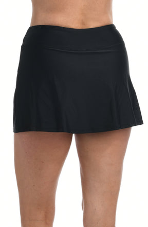 Black swim skort worn by a person on a white background. Back shot.