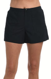 Black woven swim shorts worn by a person on a white background.