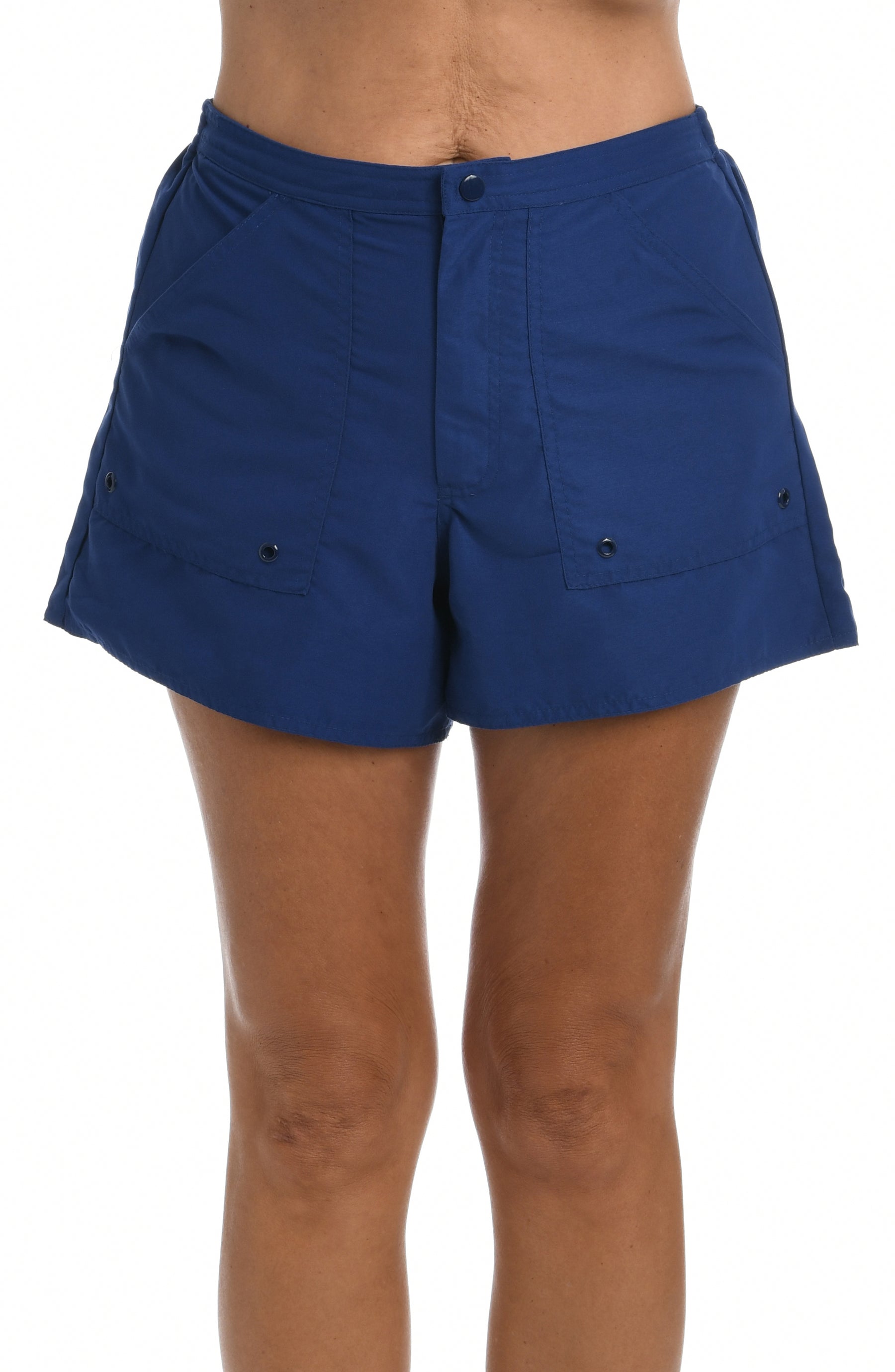 Navy blue woven swim shorts worn by a person on a white background.