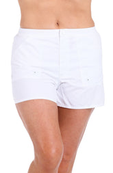 A woman wearing a white boardshort against a white background
