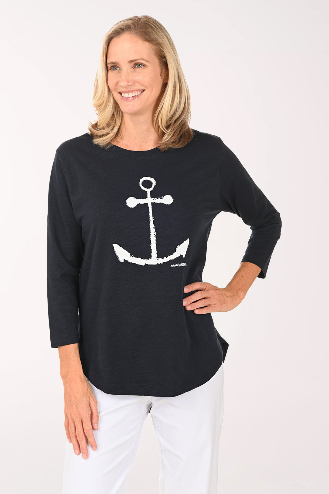 Woman wearing a white and navy 3/4 sleeve top with an anchor