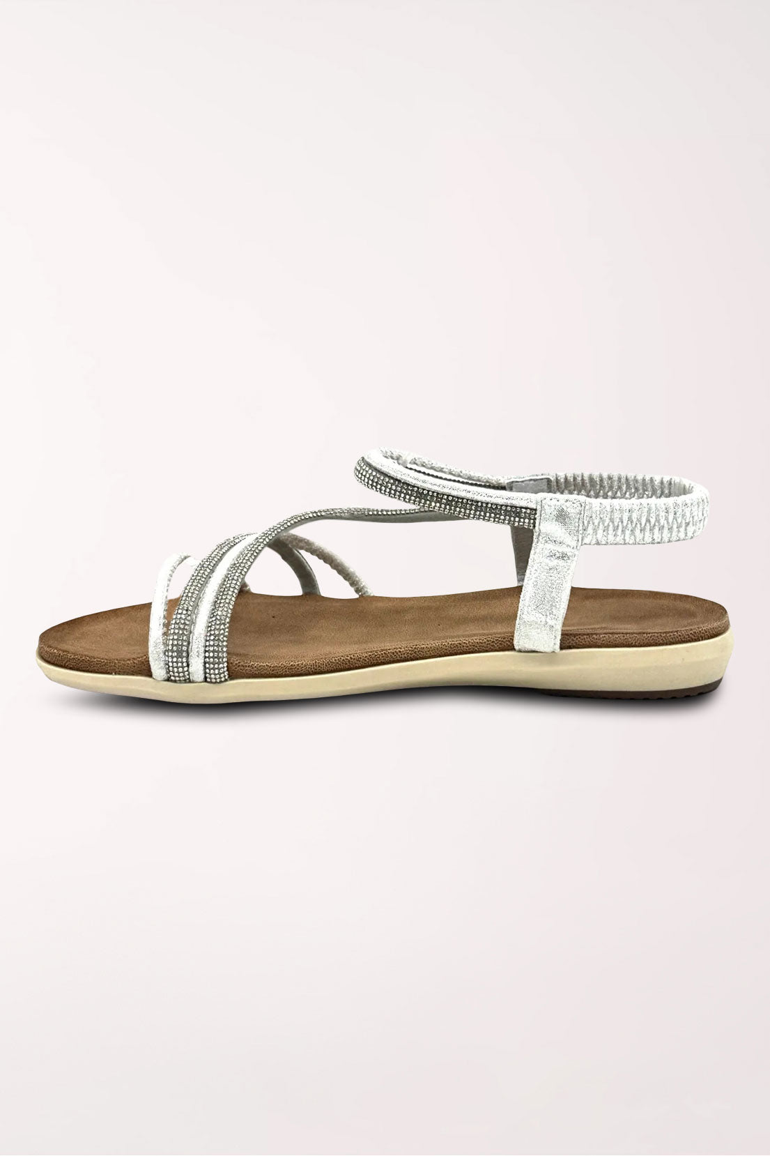 Inner side view of the silver Alina sandal showing the rhinestone straps and slingback.