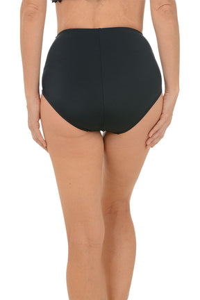 Person wearing black high-waisted bikini bottoms on a white background. Back shot.