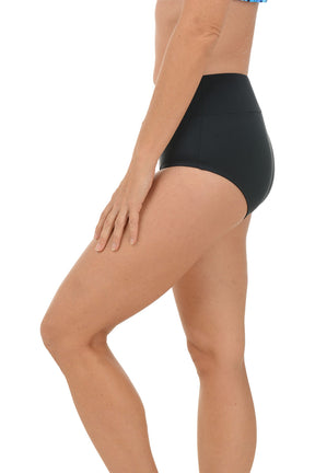 Person wearing black mid-waist bikini bottoms on a white background. Side shot.