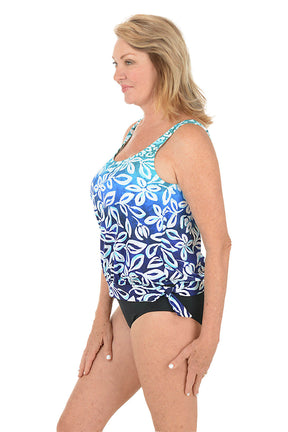 Woman wearing a blue and white floral swimsuit on a white background