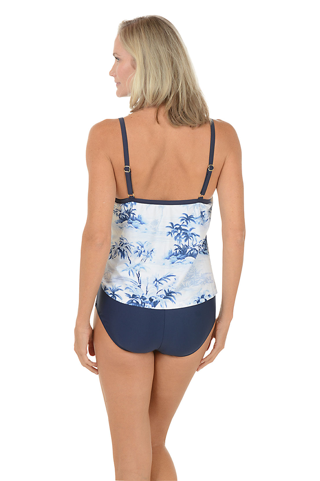 A woman wearing a blue and white one piece swimsuit. Back shot.