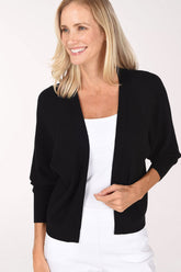 Woman wearing a black 3/4 sleeve solid cardigan 