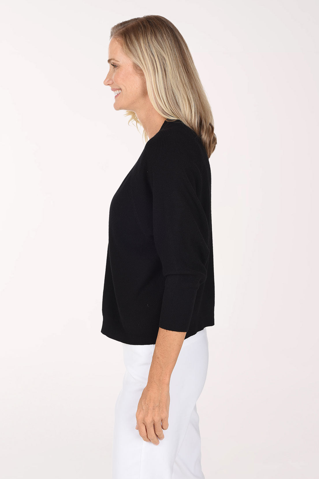 Woman wearing a black 3/4 sleeve solid cardigan 
