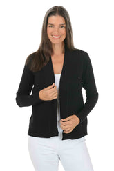 Woman wearing a black cardigan over a white top on a white background.