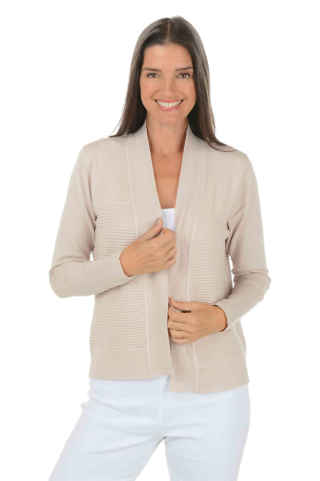 Woman wearing a beige cardigan over a white top on a white background.