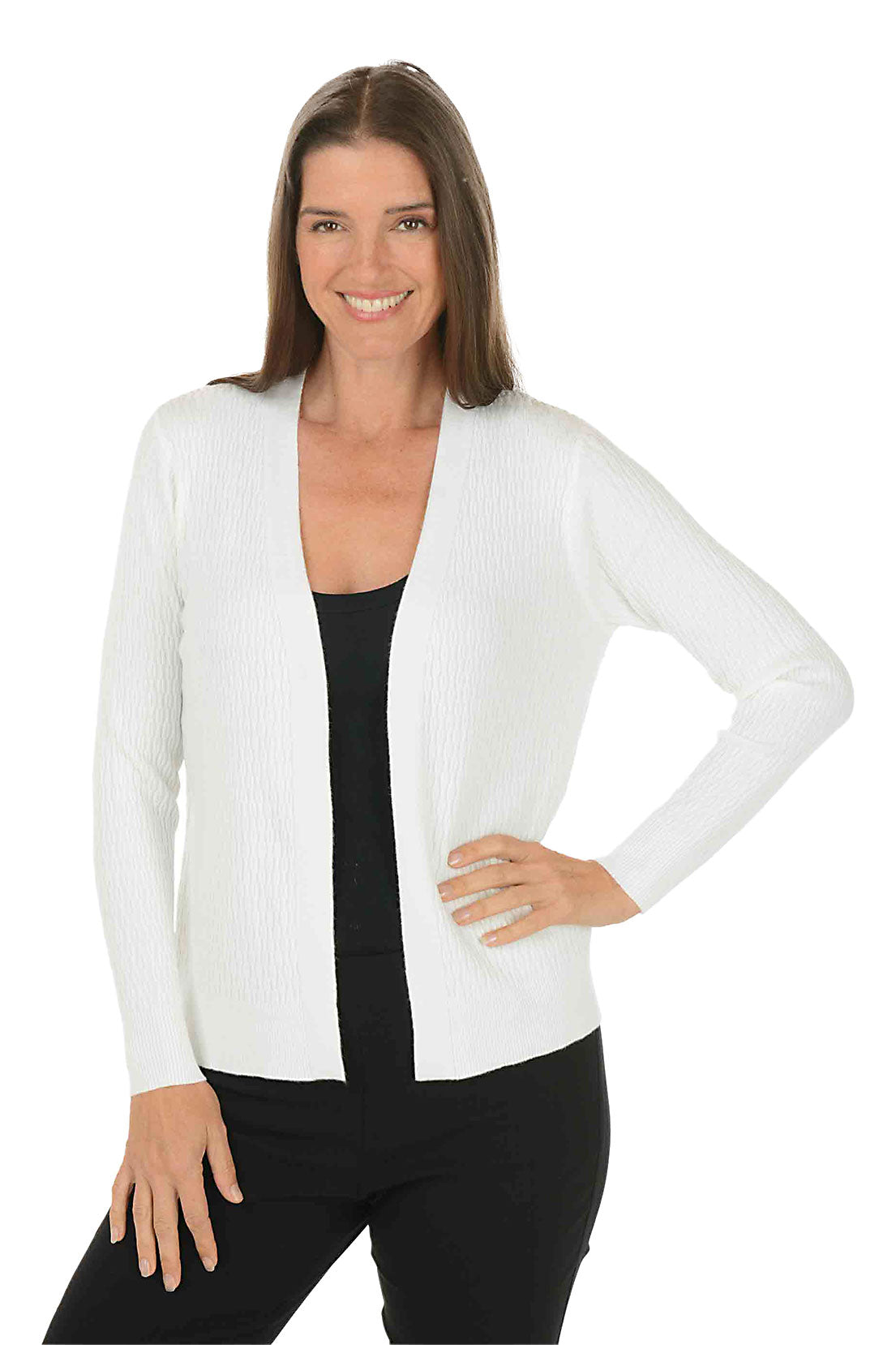 Woman wearing a long sleeve white cardigan sweater over a white top on a white background.