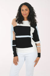 Woman wearing a black and white striped sweater with cut-out sleeves on a white background