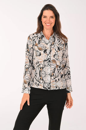 Woman wearing a black long sleeve shirt with a butterfly print.