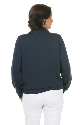 Woman wearing a navy blue pullover sweater with a zipper on a white background. Back shot.