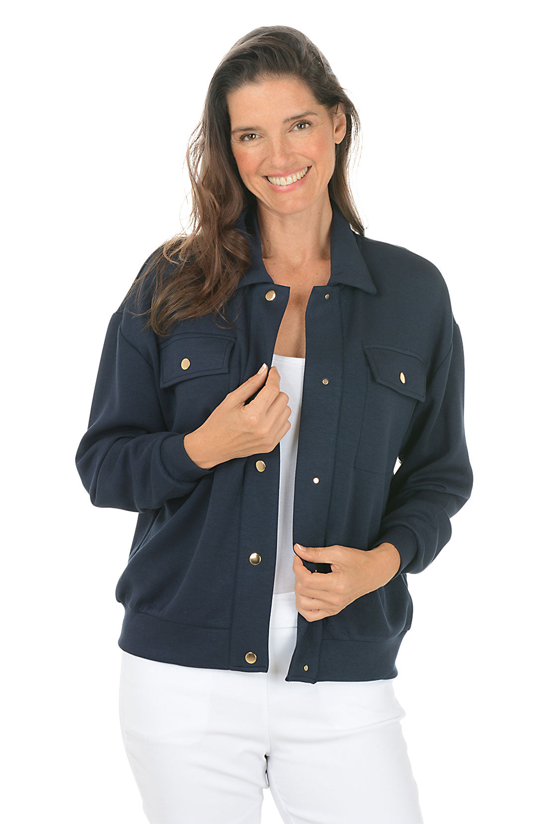 Woman wearing a navy blue jacket with gold buttons on a white background.