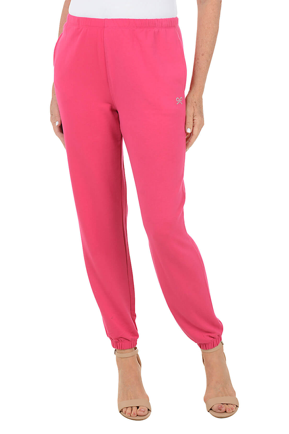 Pink sweatpants worn by a person on a white background