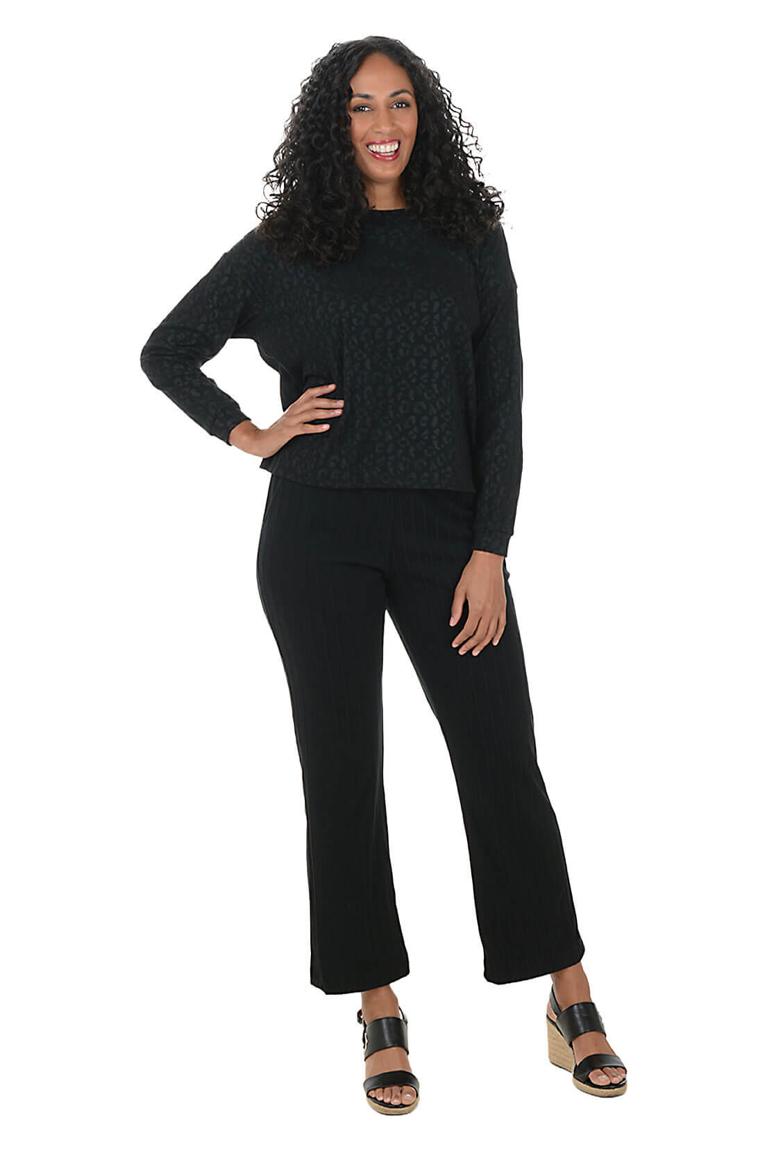 Woman wearing a black outfit on a white background