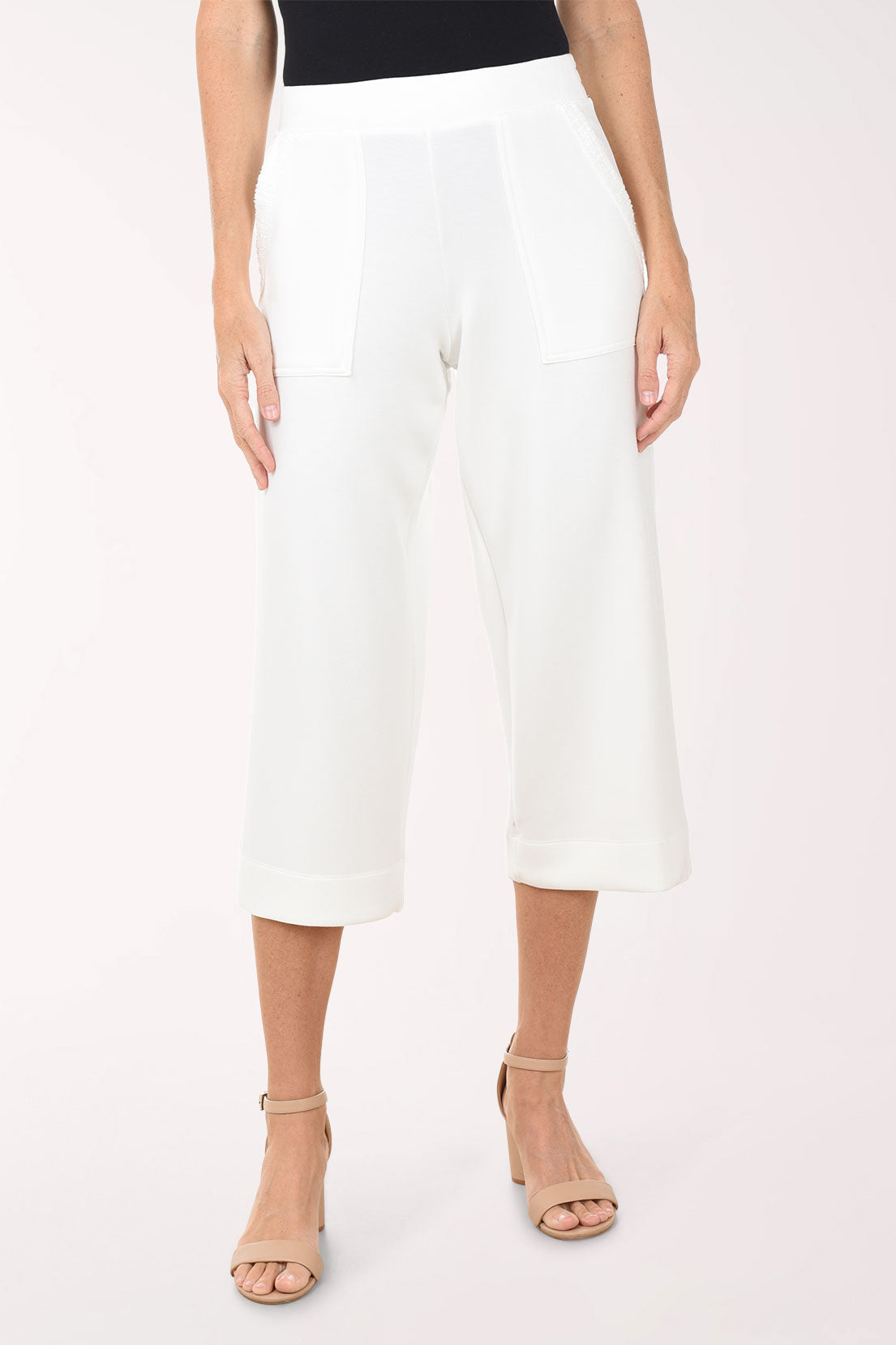 White wide-leg pants worn by a person on a white background