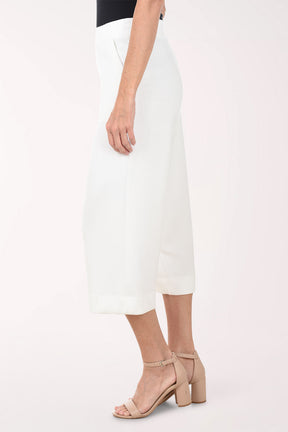 White wide-leg pants worn by a person on a white background