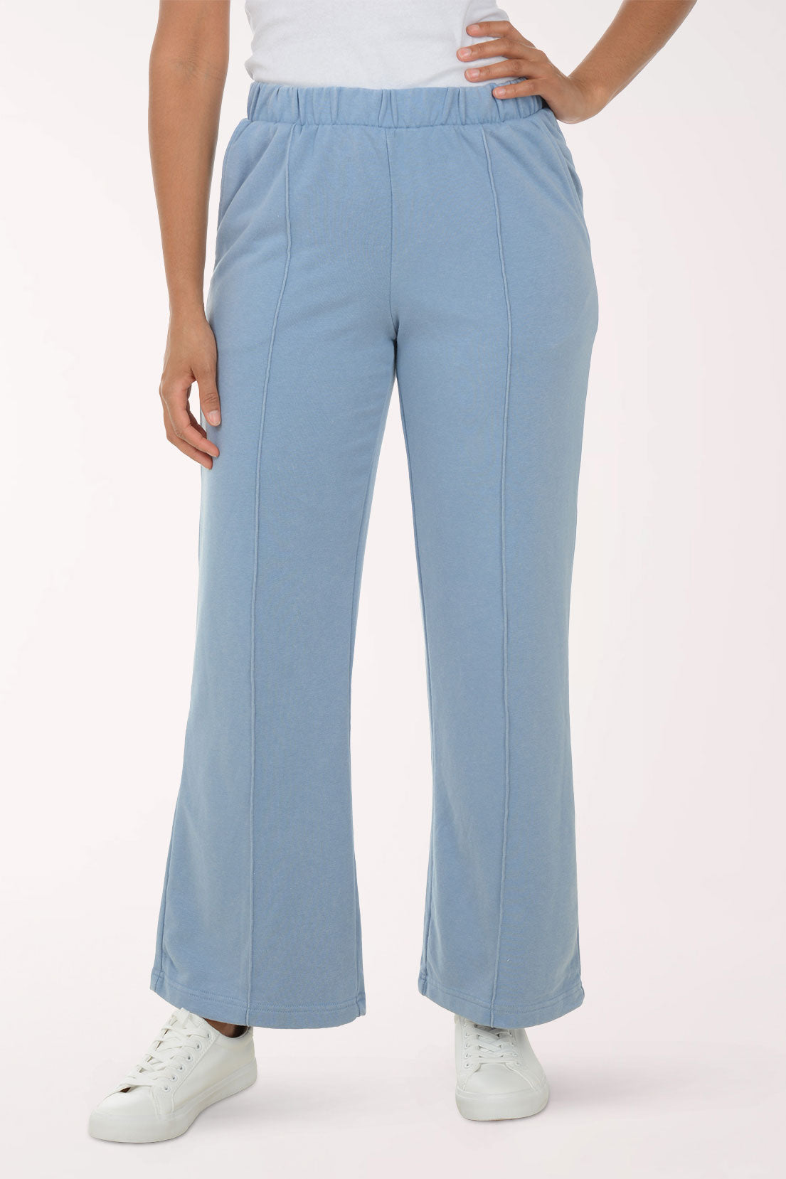 Light blue pants worn by a person on a white background