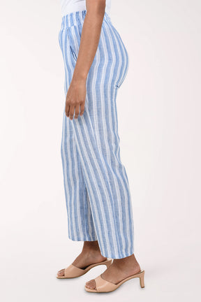 Blue and white striped pants worn by a person on a white background