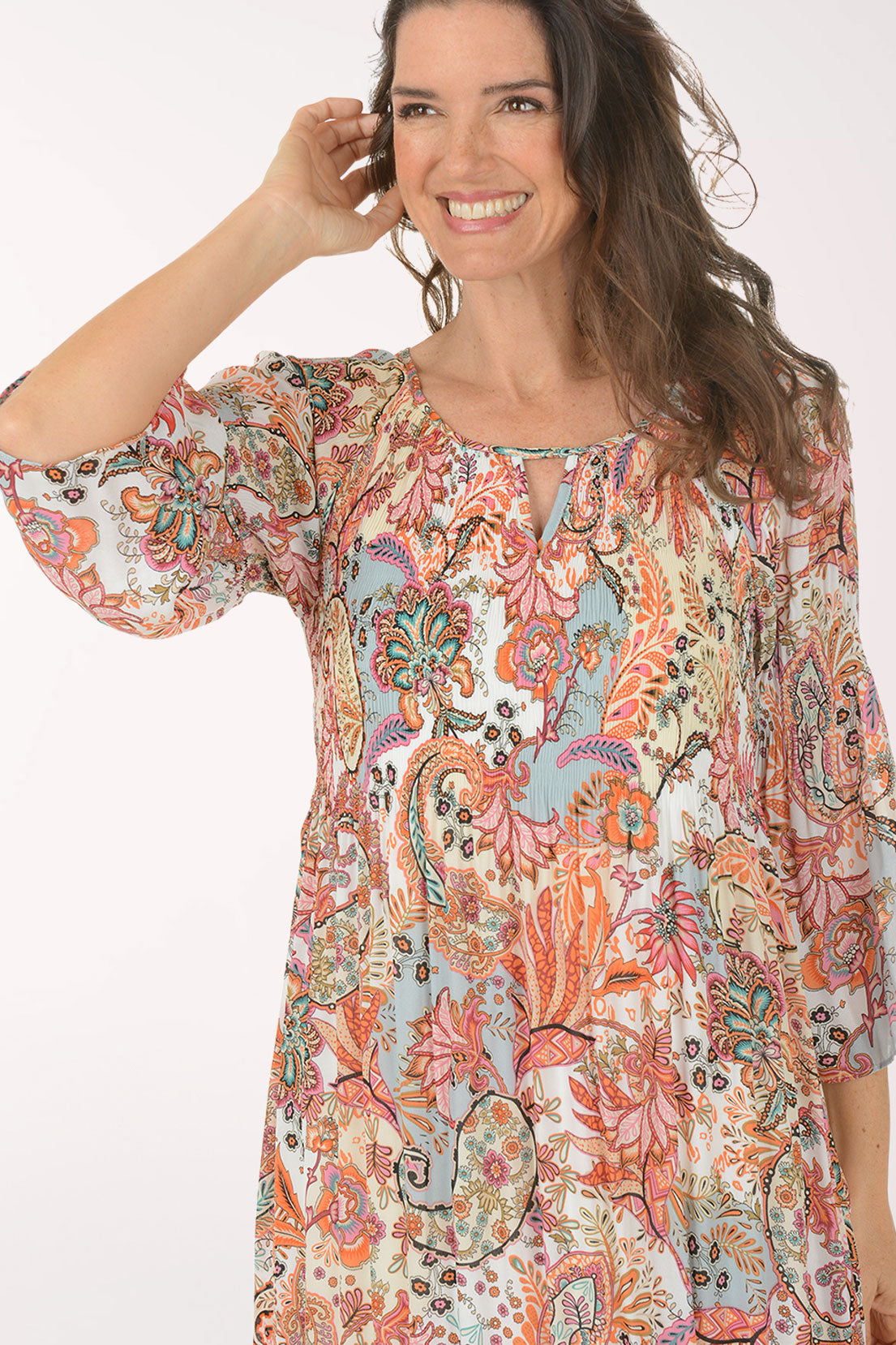 Woman wearing a floral dress on a white background