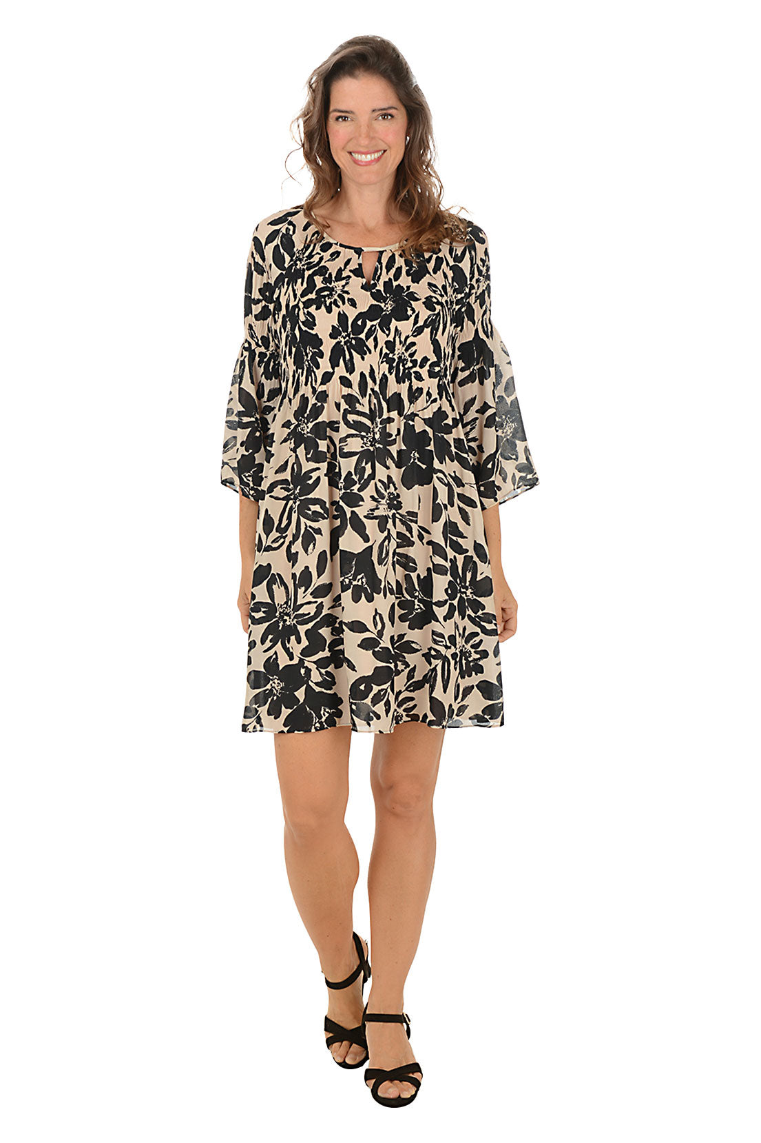 Woman wearing a floral dress on a white background. Second front shot.