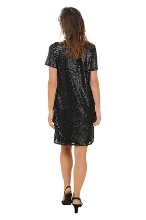 Woman wearing a black sequin dress on a white background. Back shot.