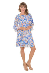 Woman wearing a blue multi paisley patterned dress with 3/4 sleeves.