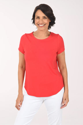 Woman wearing a red shirt on a white background