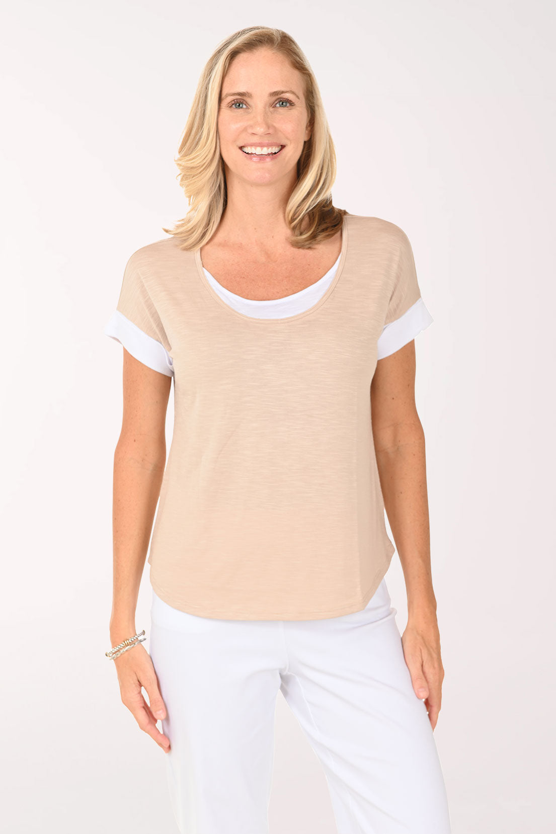 Woman wearing a beige short sleeve shirt