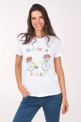 Woman wearing a white t-shirt with a bicycle graphic and 'Summer Vibes' text on a white background