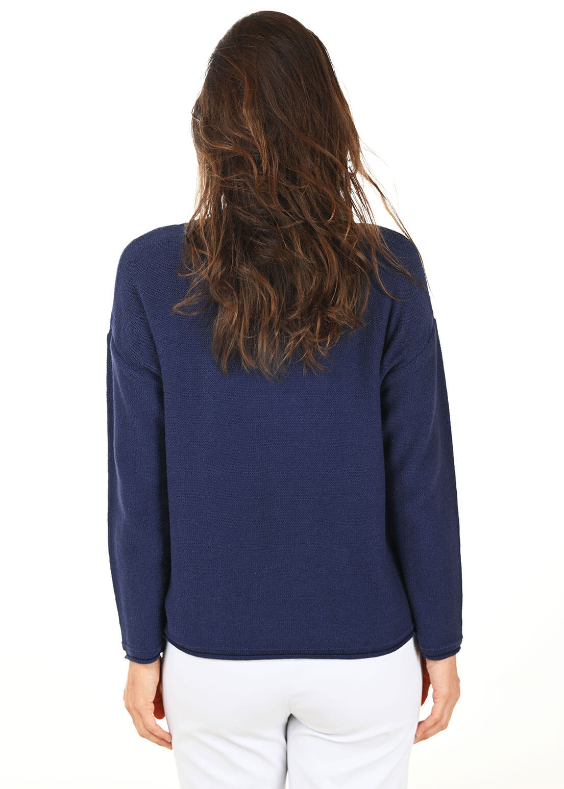 Person wearing a navy blue long-sleeve top on a white background