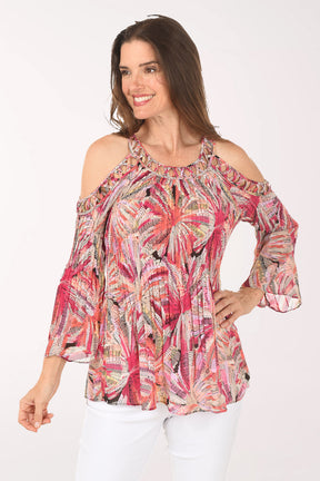 Woman wearing a colorful floral blouse on a white background