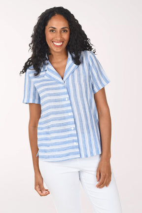 Woman wearing a blue and white striped shirt on a white background