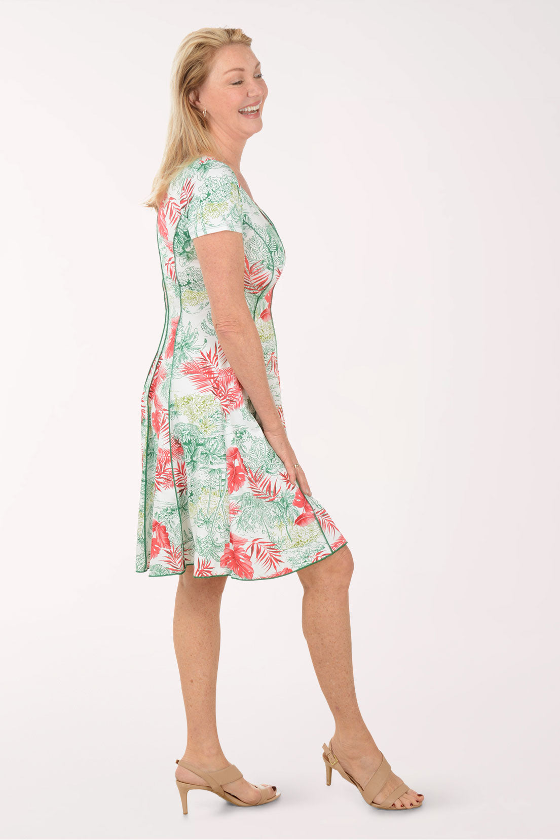 Woman wearing a floral dress on a white background